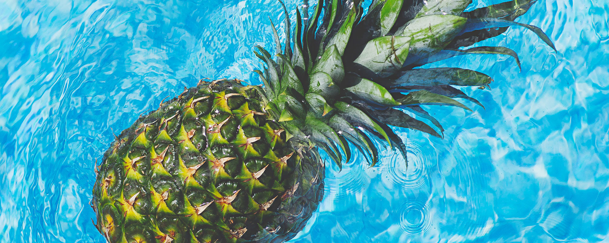 pineapple floating in water