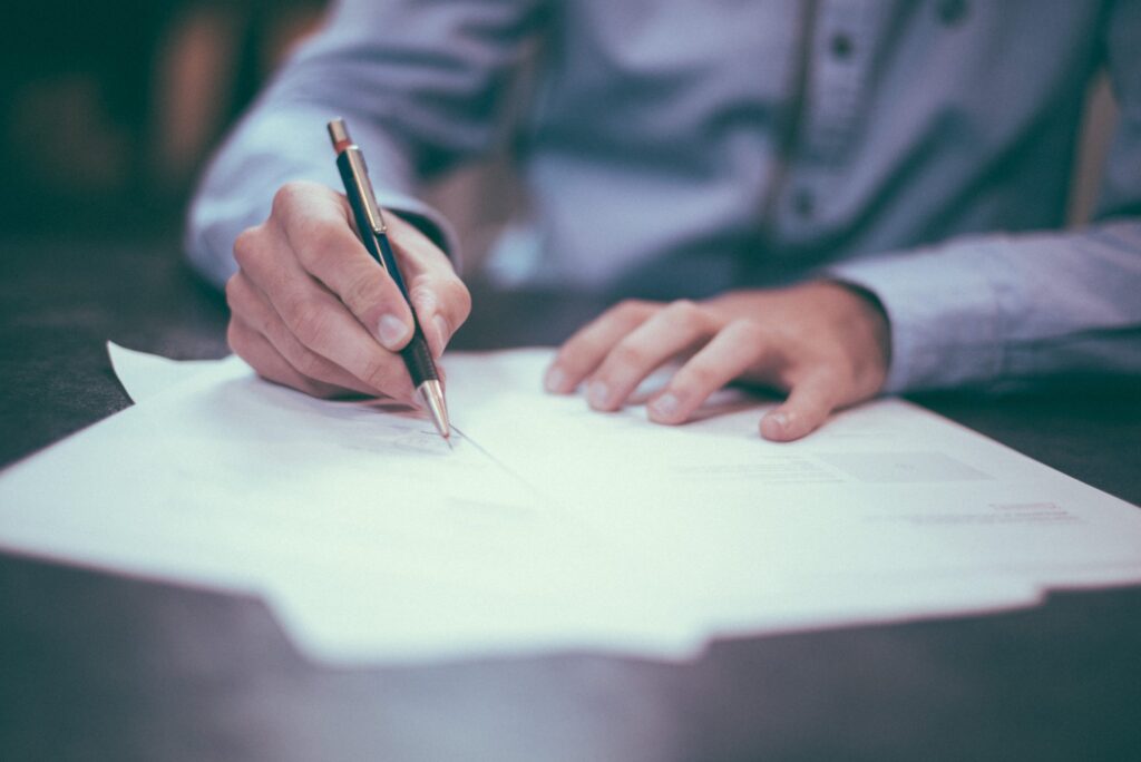 person filling out documents