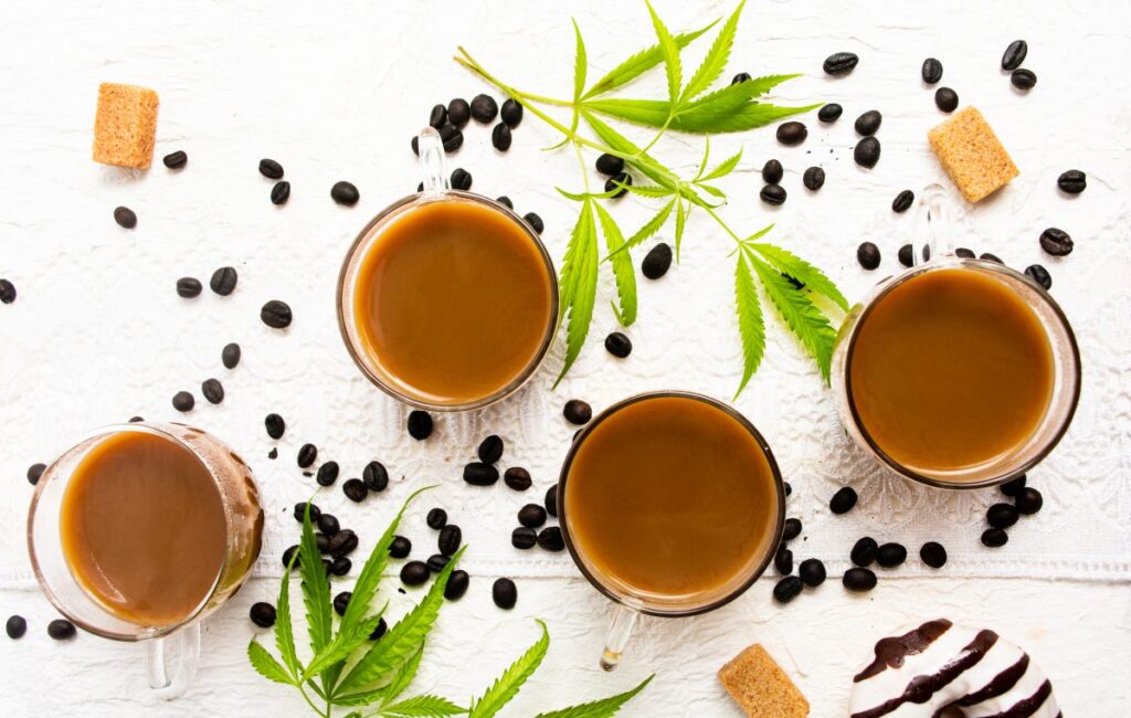 four cups of coffee with coffee beans
