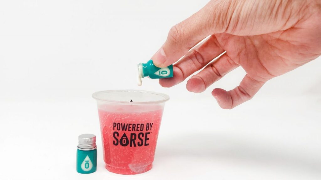 hand pouring SoRSE cbd emulsifier into plastic cup